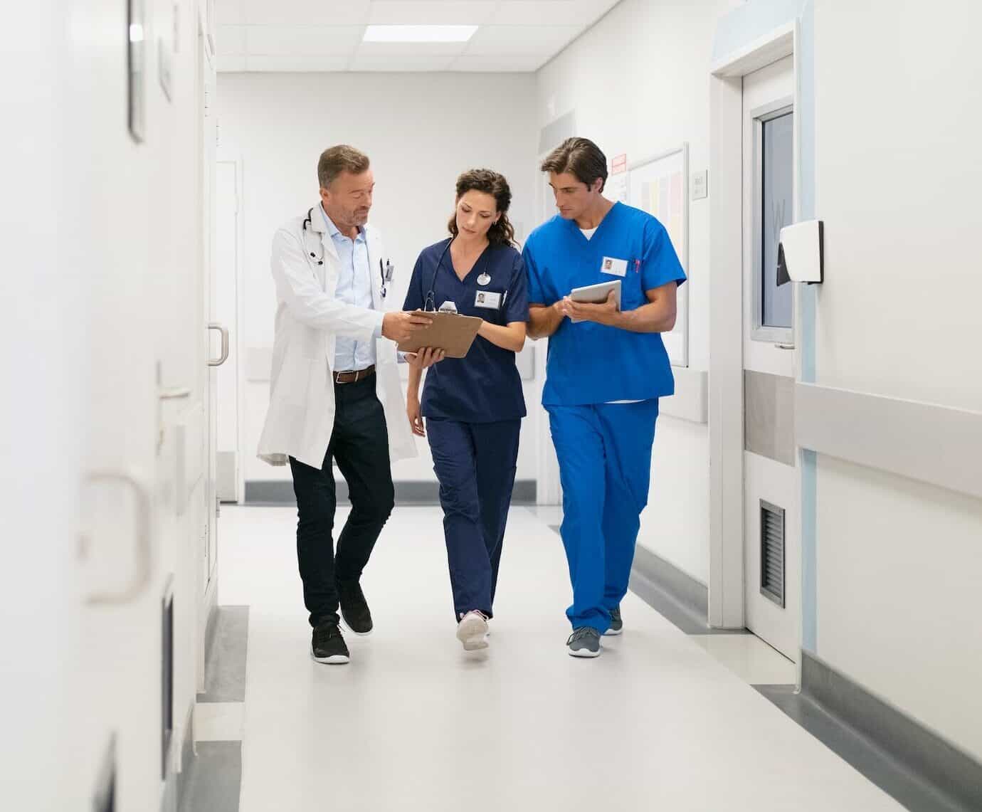 Medical staff discussing report at hospital